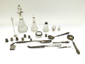 A collection of silver items including thimbles marrow scoop vesta and perfume bottles. Postage D