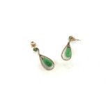 A 14ct gold pair of jade earrings. Approx weight 4
