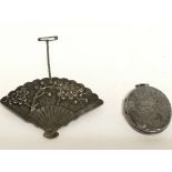 A Chinese silver fan brooch and a silver locket. P