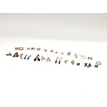 A collection of 26 pairs of silver earrings. Posta