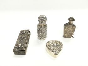 A collection of silver items including perfume bot