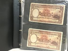 A collection of world bank notes including Hong Ko