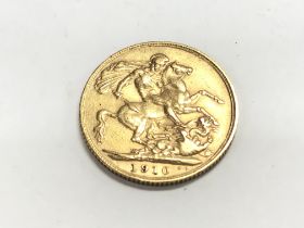 A 1910 full sovereign. Postage A