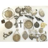 A collection of silver jewellery, including pendan