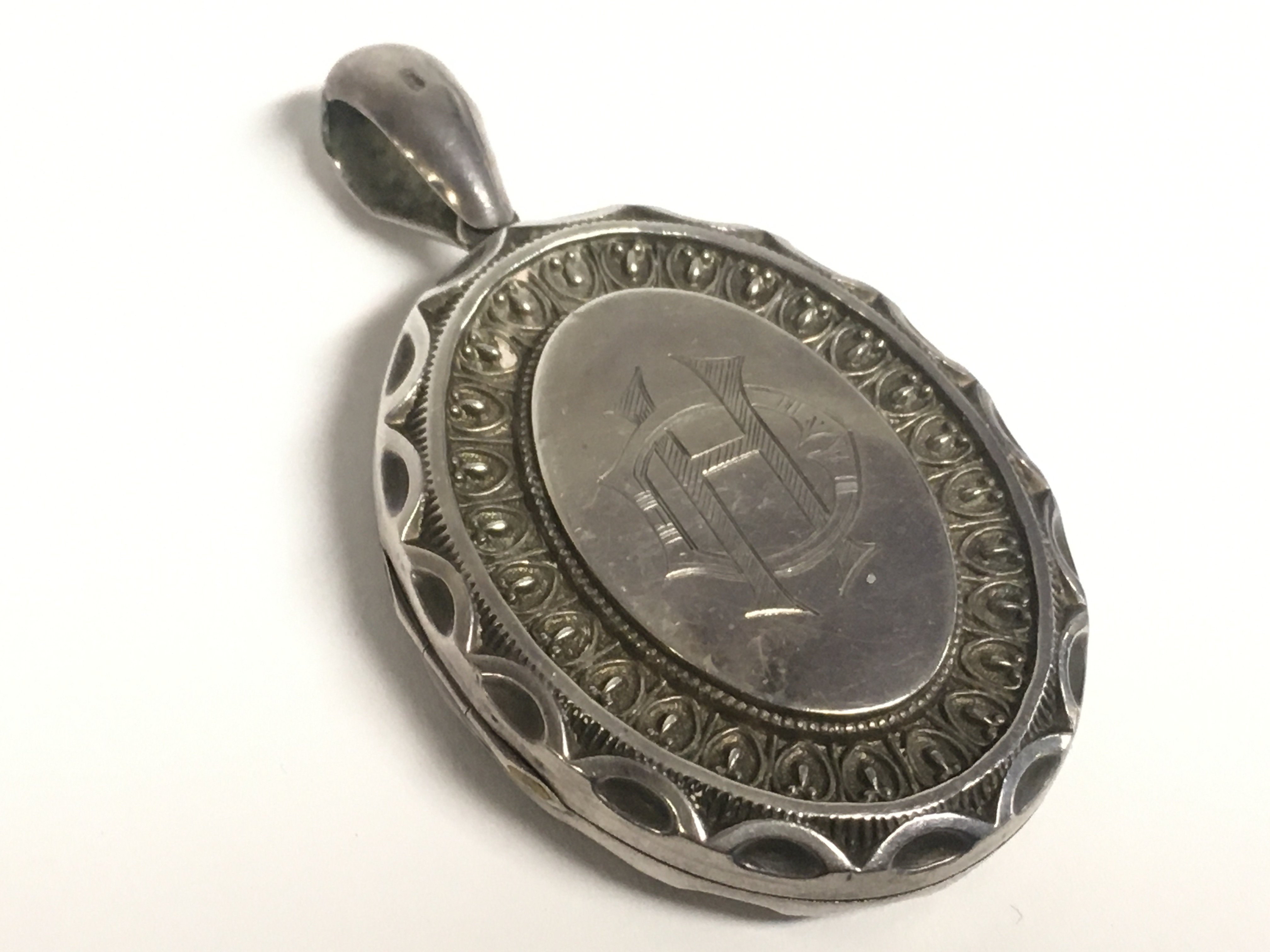 A Victorian silver locket pendant. Postage categor
