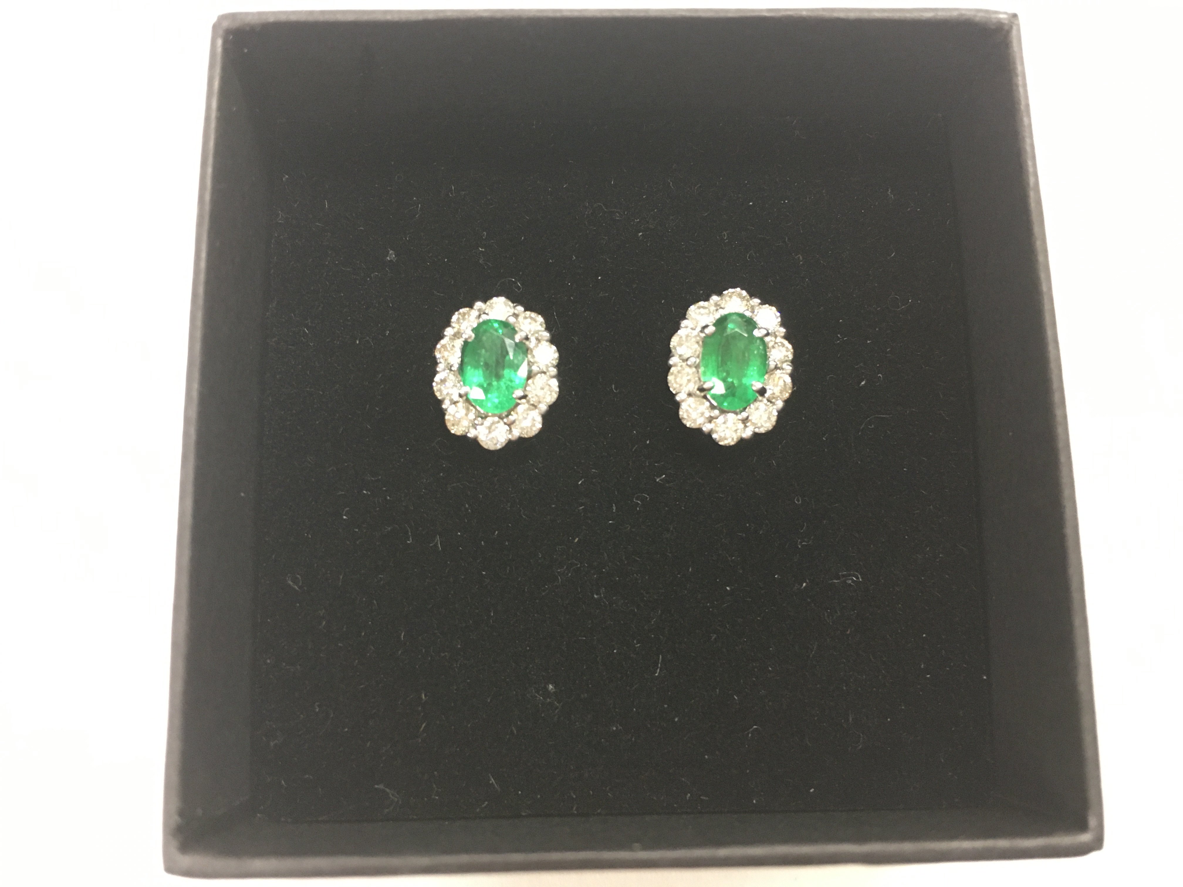 Pair of 18ct white gold studs set with oval emeral