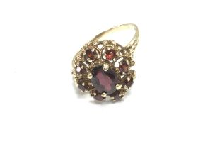 A 9ct gold garnet ring. Size R and 3.70g Postage A