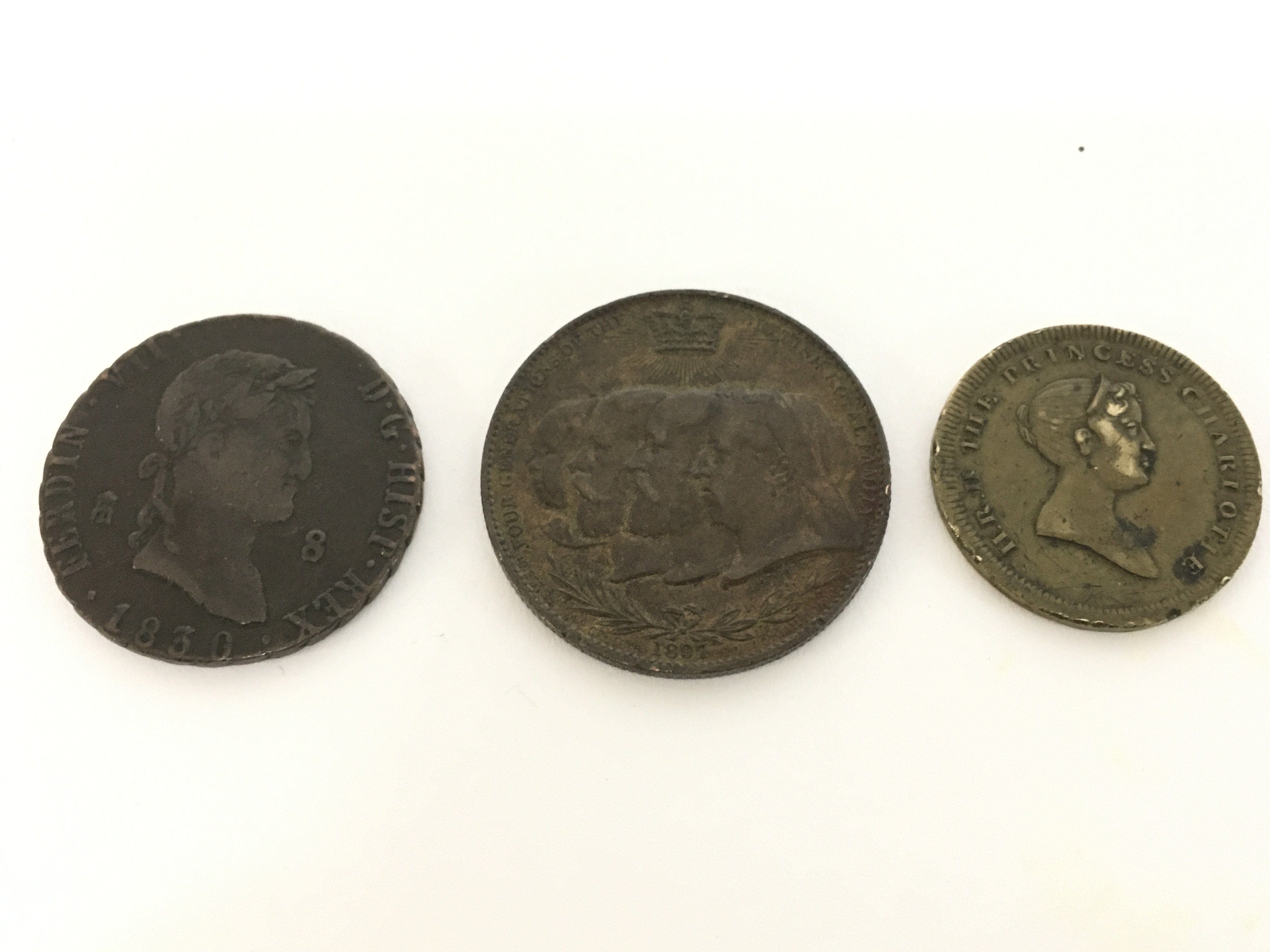 Three bronze coins including a Spanish 1830 Ferdin