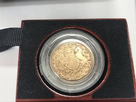 A 2022 gold proof sovereign with COA. Postage B