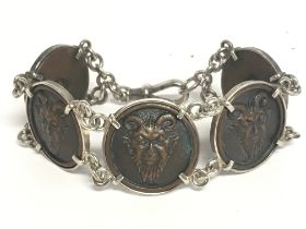 A vintage silver and bronze Satyr bracelet. Postag