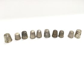 A collection of 10 thimbles. Postage B