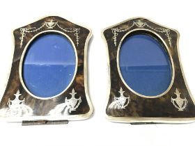 A pair of tortoise shell and silver frames. Birmin