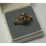 An Edwardian 18ct gold seed pearl and diamond ring