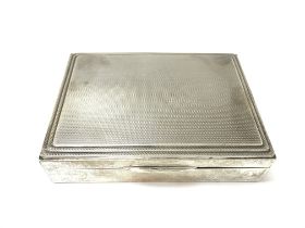 A small silver Mappin and Webb cigarette box with Birmingham hallmarks 1939. 272g. 12cm by 9cm.