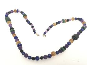 A vintage lapis, amethyst and agate bead necklace.