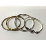 4 Silver and gilt metal stone set bangles (A)