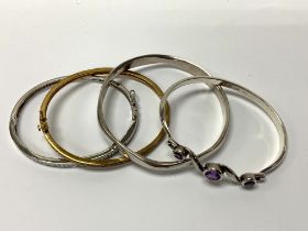 4 Silver and gilt metal stone set bangles (A)