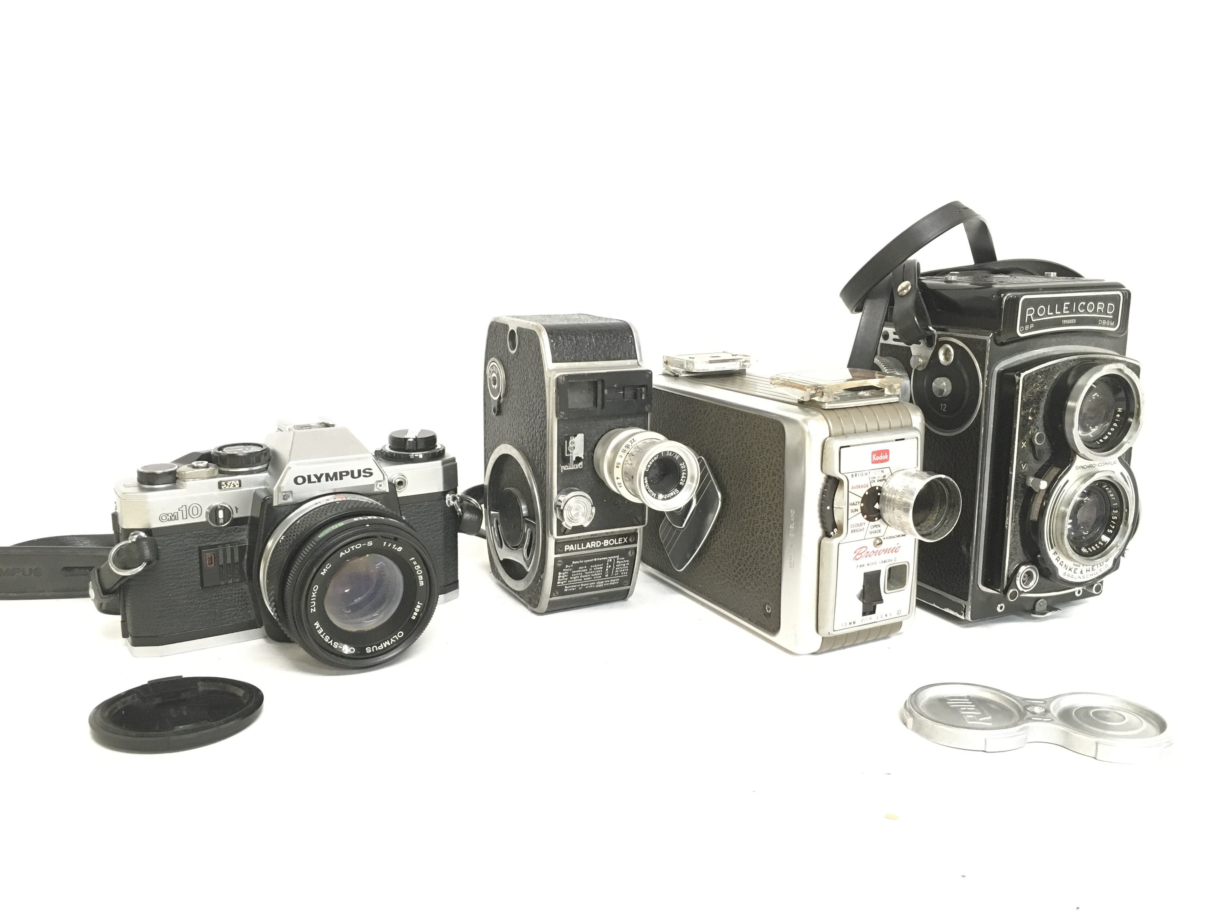 Vintage cameras including an Olympus OM10, Paillar