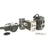 Vintage cameras including an Olympus OM10, Paillar