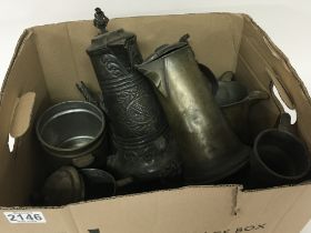 A box containing a collection of antique Pewter ju