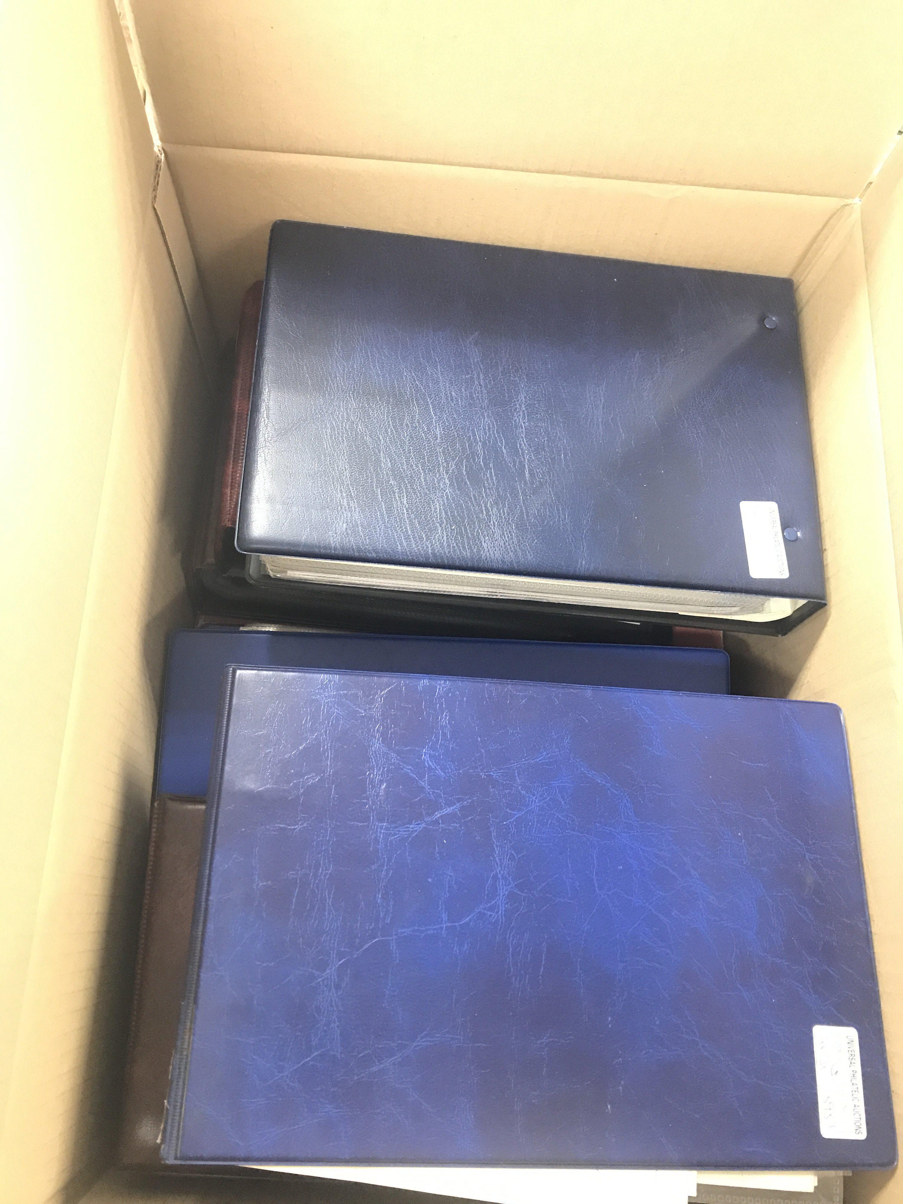 A box containing a large collection of albums of f