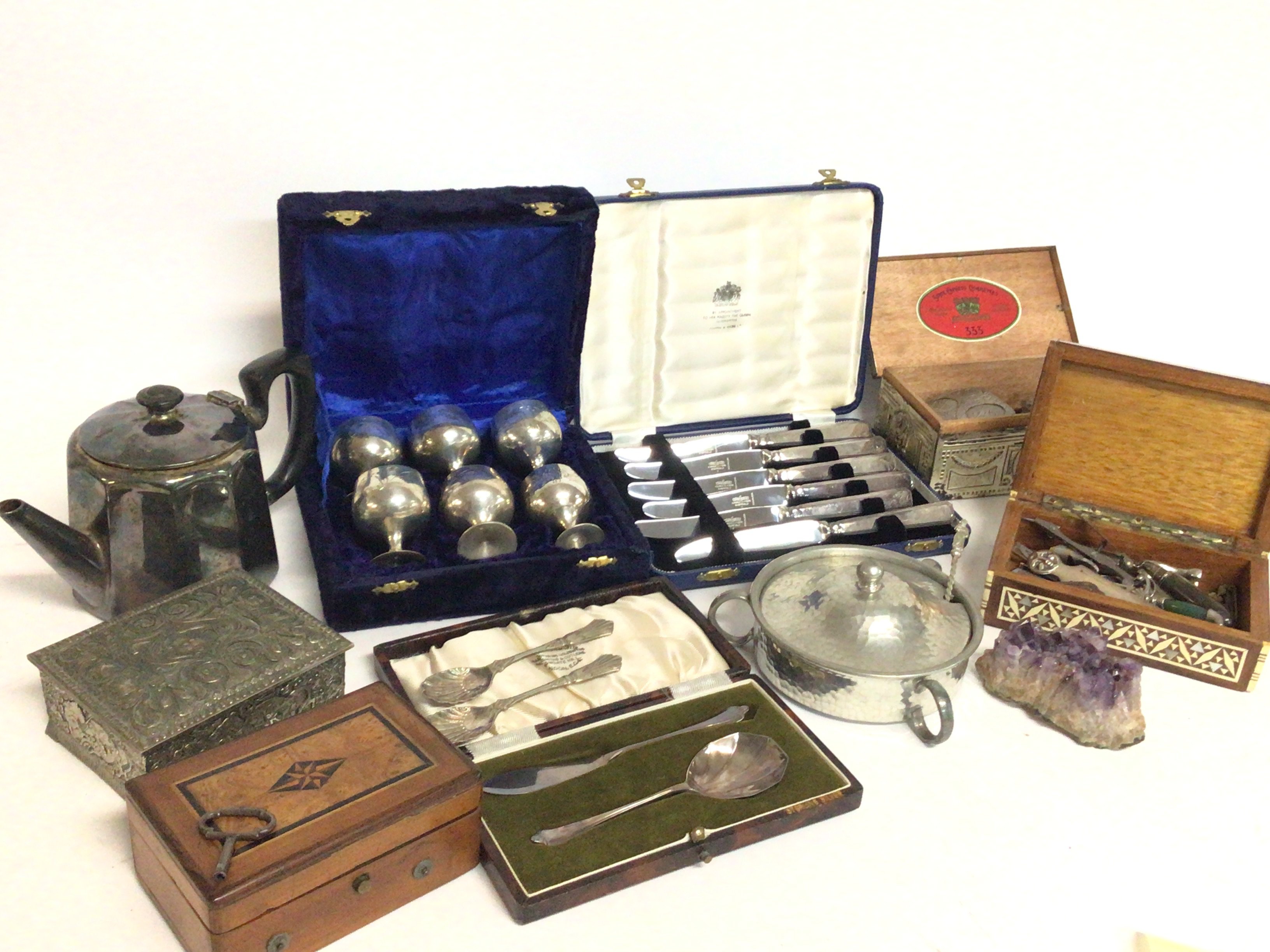 A collection of silver plate items including minia