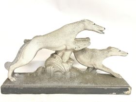 An Art Deco style greyhound composition sculpture