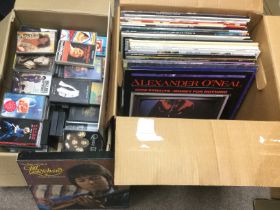 Two boxes of LPs and cassettes by various artists