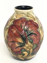 A Moorcroft Spanish vase. 14cm tall. No obvious da