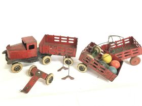 A vintage tin plate toy truck with extras. This lo