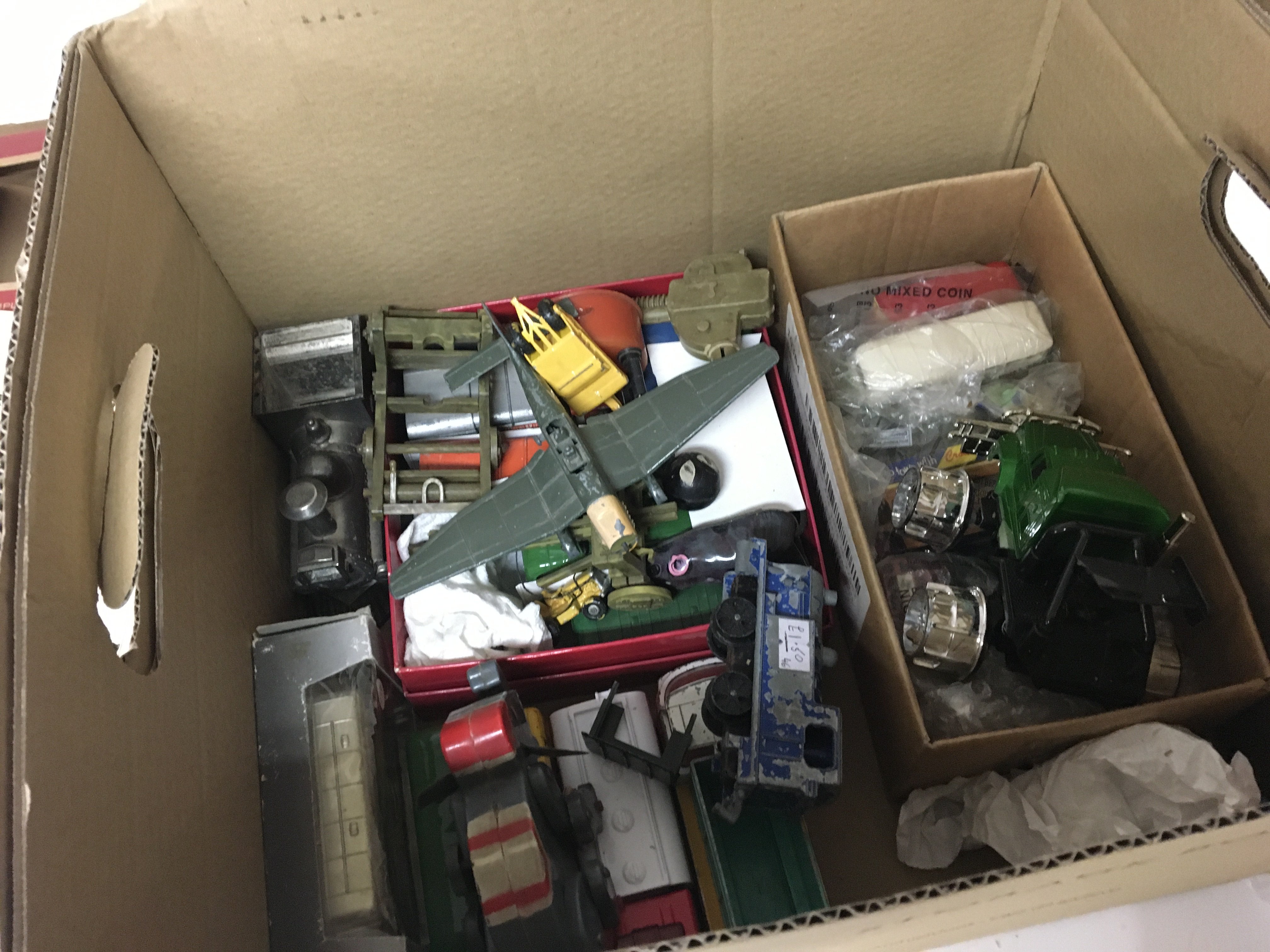 A collection of playworn cars and toys and a boxed