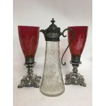 An etched glass claret jug and ruby glass candle h