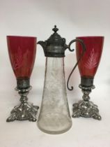 An etched glass claret jug and ruby glass candle h