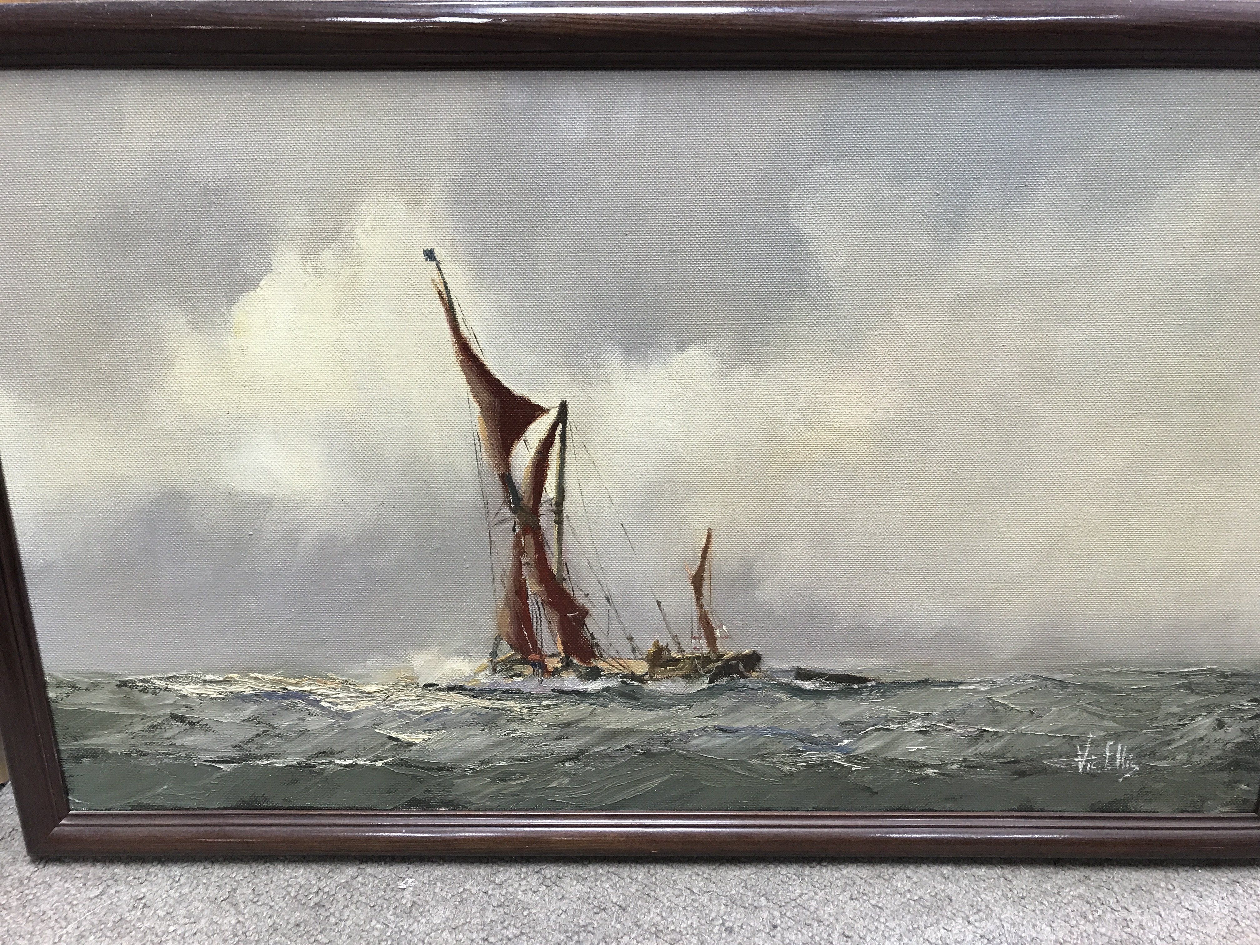 A framed oil on canvas depicting a Thames barge si