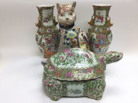 Four Canton ceramic items comprising a pair of vas