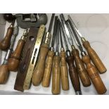 A collection of vintage woodworking tools includin