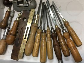 A collection of vintage woodworking tools includin