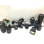 A collection of vintage cameras including Pentax M