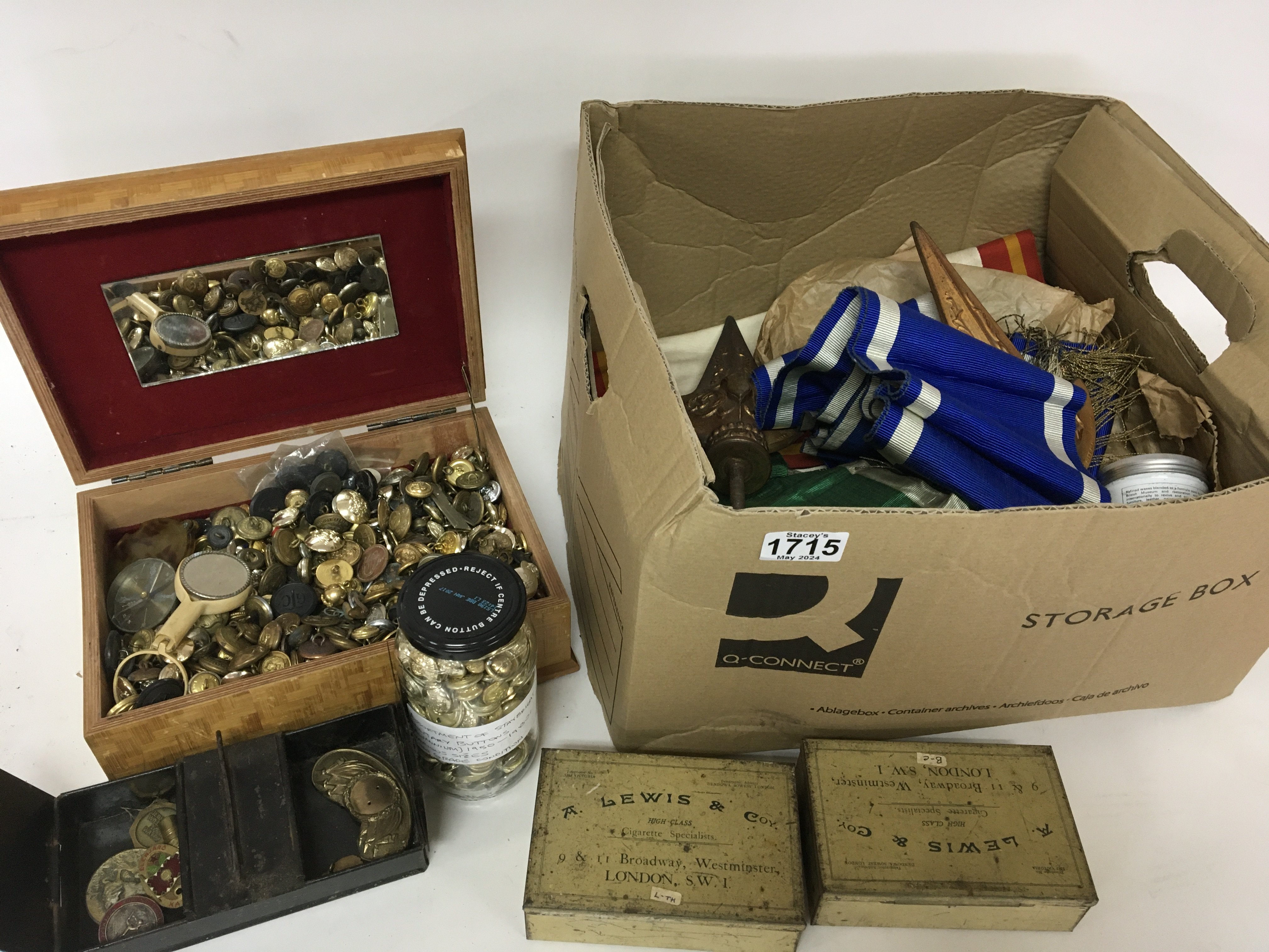 A box containing mix military buttons various colo