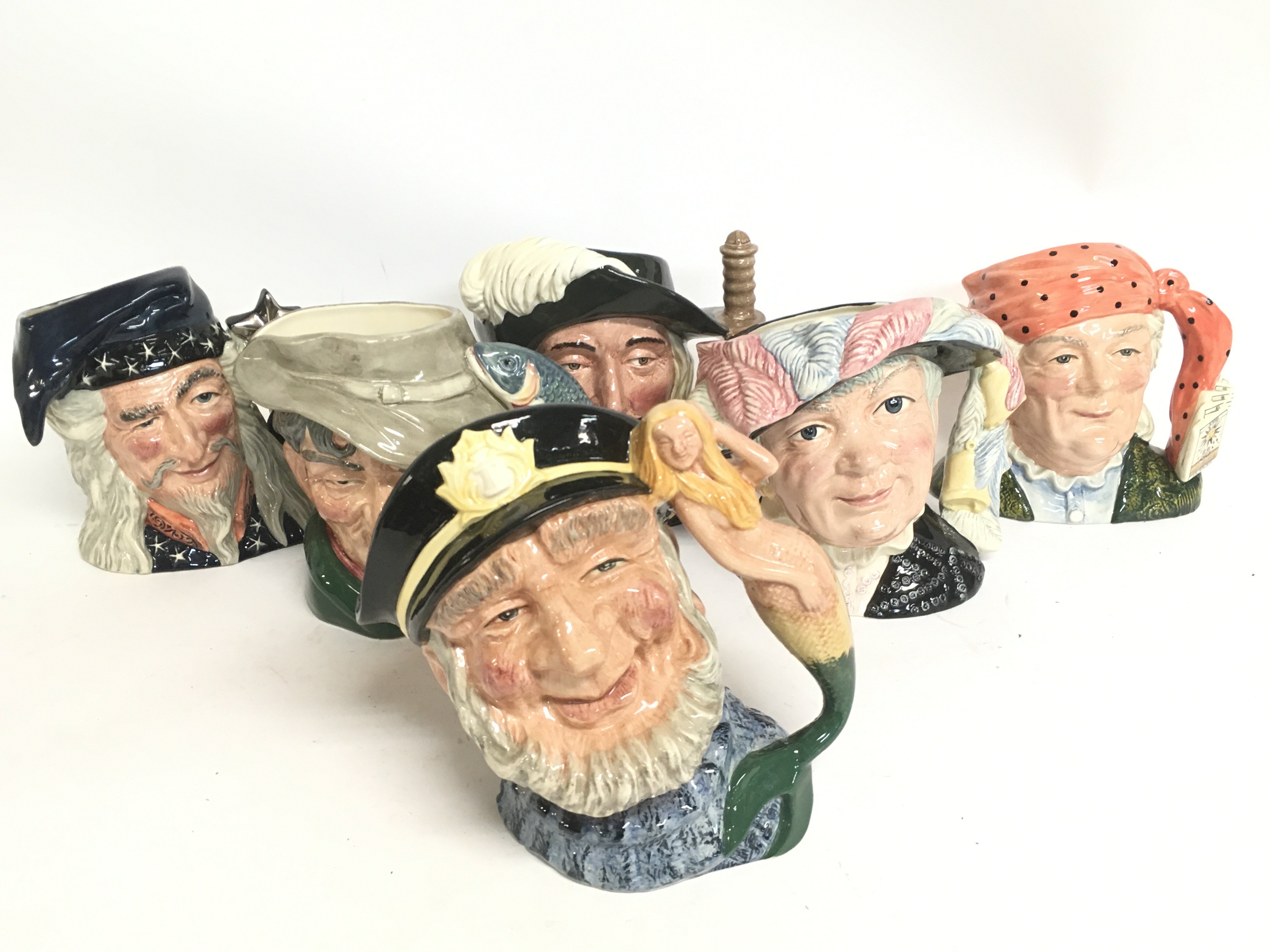 A collection of Royal Doulton character jugs inclu