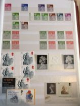 Five albums containing British commonwealth stamps