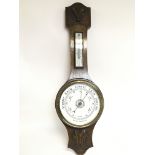 An oak barometer with a damaged mercury box, 80cm