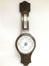 An oak barometer with a damaged mercury box, 80cm