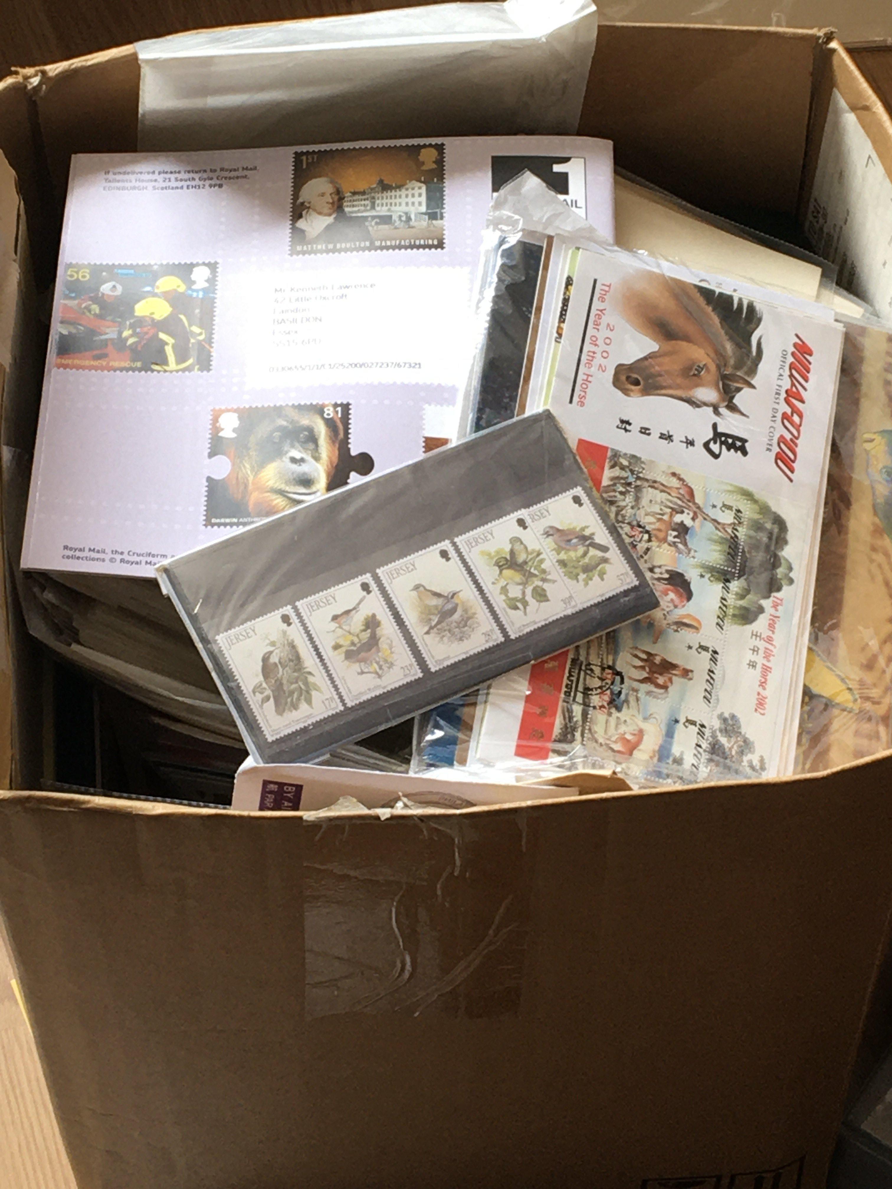 A box containing a large quantity of world stamps