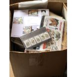 A box containing a large quantity of world stamps