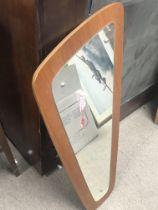 An Art Deco design wall mirror. 73cm long.