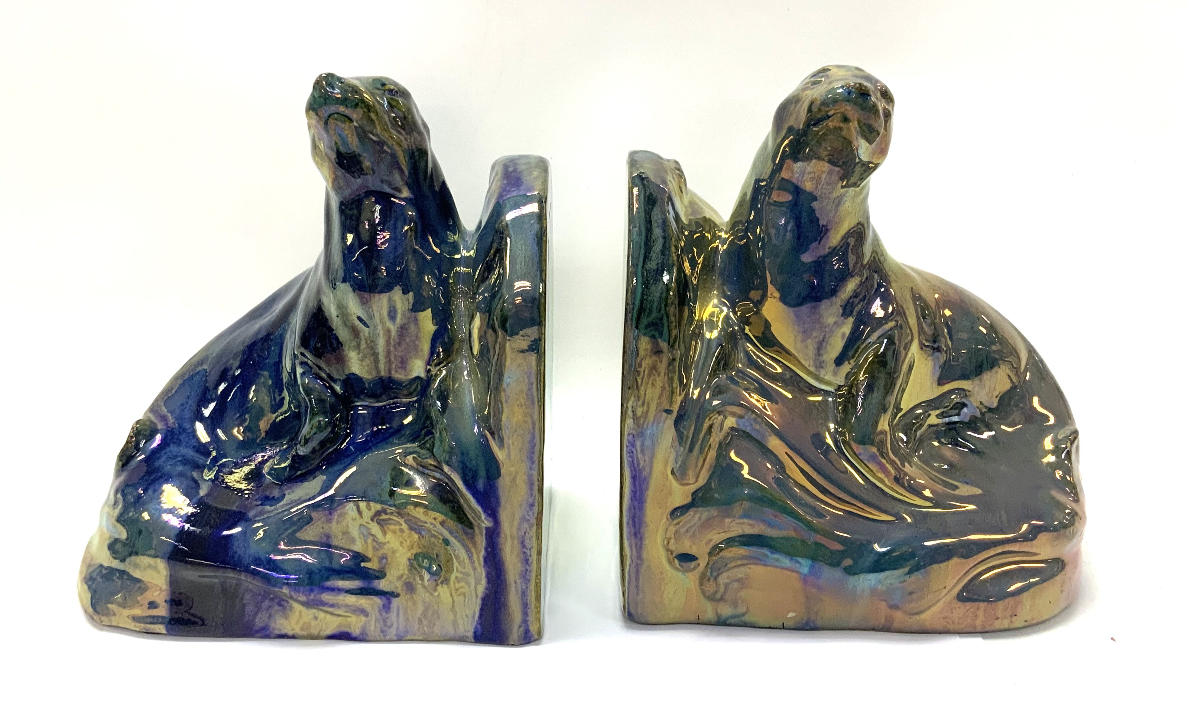 A pair of Art Deco bookends in the form of two cer