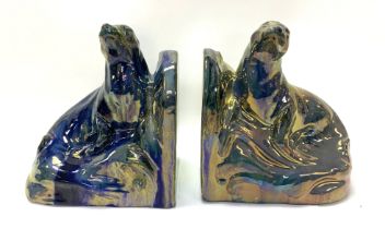 A pair of Art Deco bookends in the form of two cer