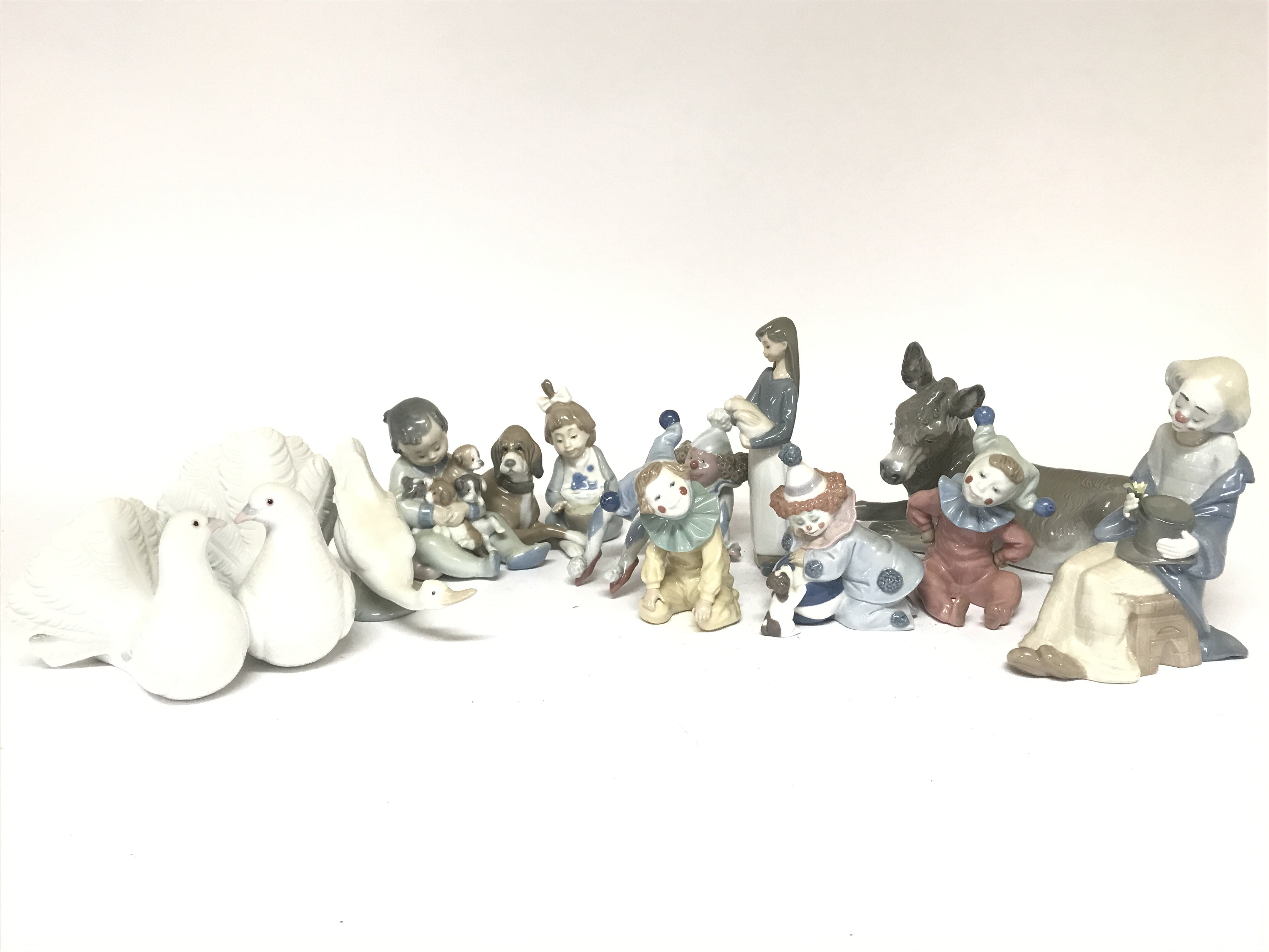 A Collection of Lladro and Nao figures including c