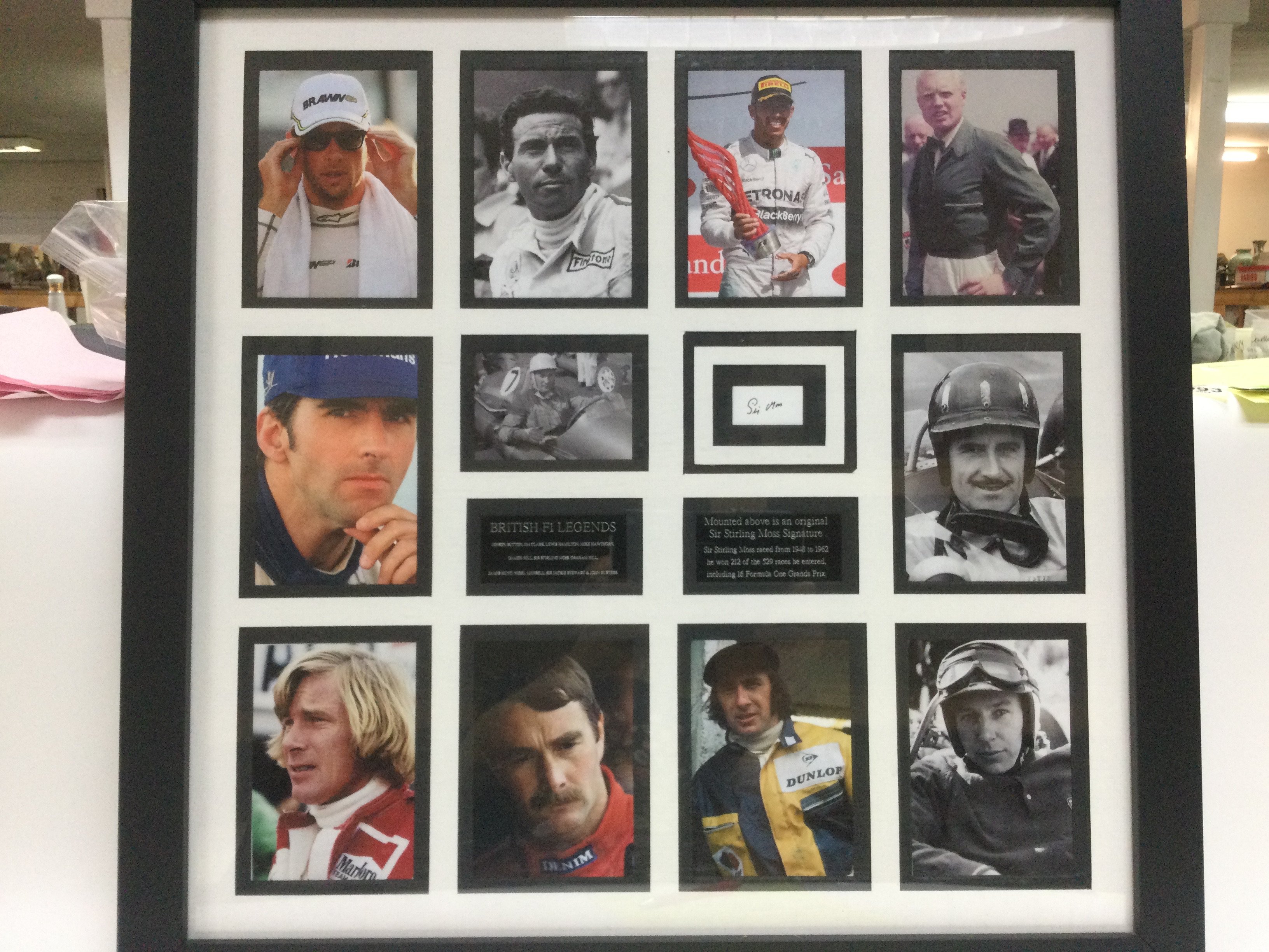 A framed snd glazed display of British F1 legends
